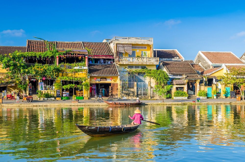 Traditional floating market on the Mekong River in Vietnam with colorful boats selling tropical fruits