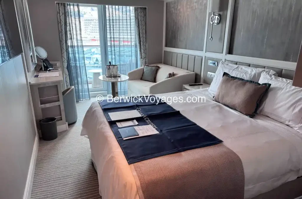 Concierge Veranda stateroom 10082 on Deck 10 of Oceania Allura, the standard Concierge category with 291 square foot floor plan